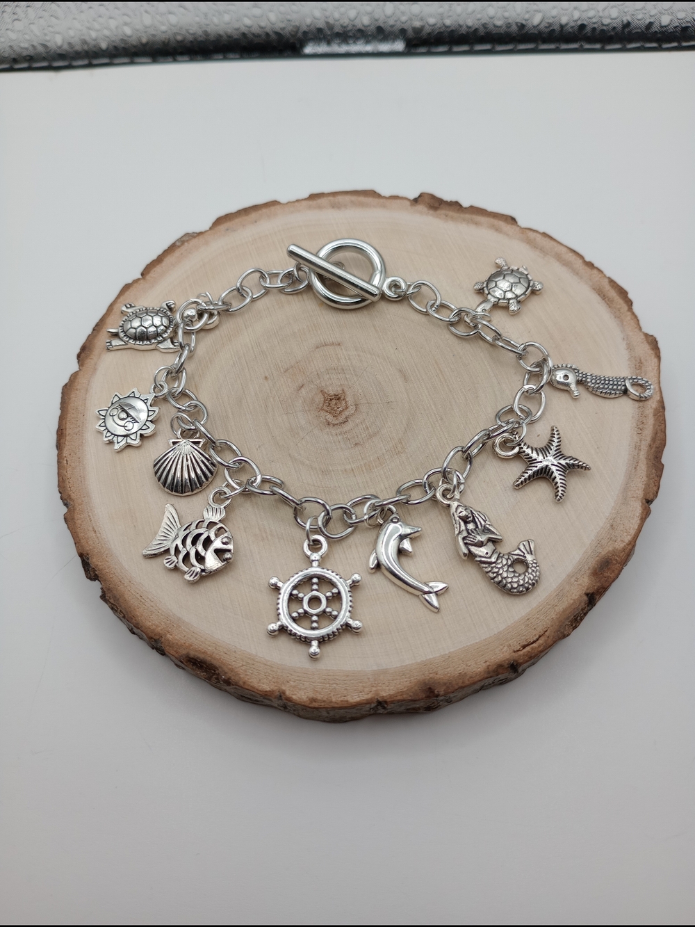 Silver Nautical Charm Bracelet with Ocean Motifs